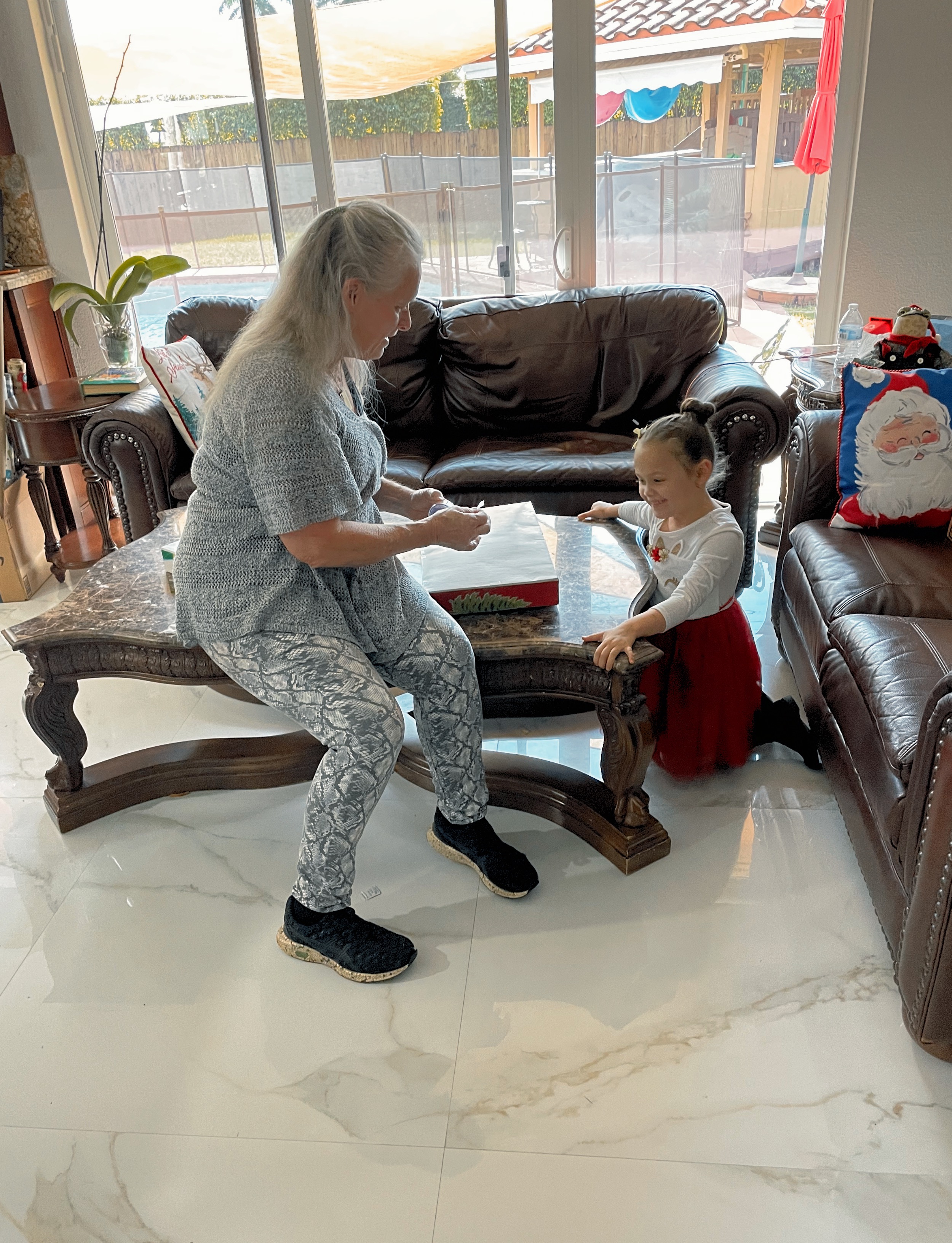 Nana wrapping presents with Elianna 12/3/2023