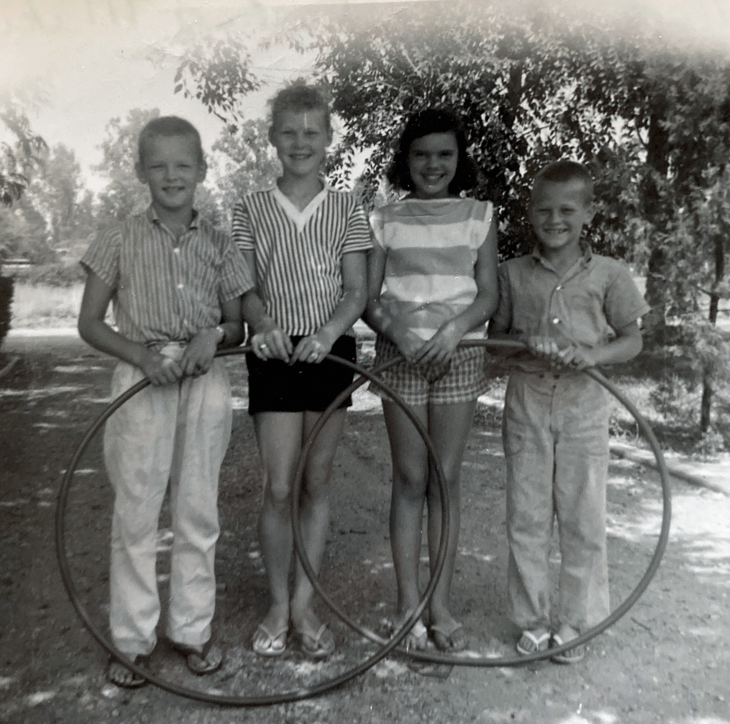 Mark and Pat Davey, a friend, Linda, and Mike Davey with Hula Hoops. Fontana, California.
Circa 1958