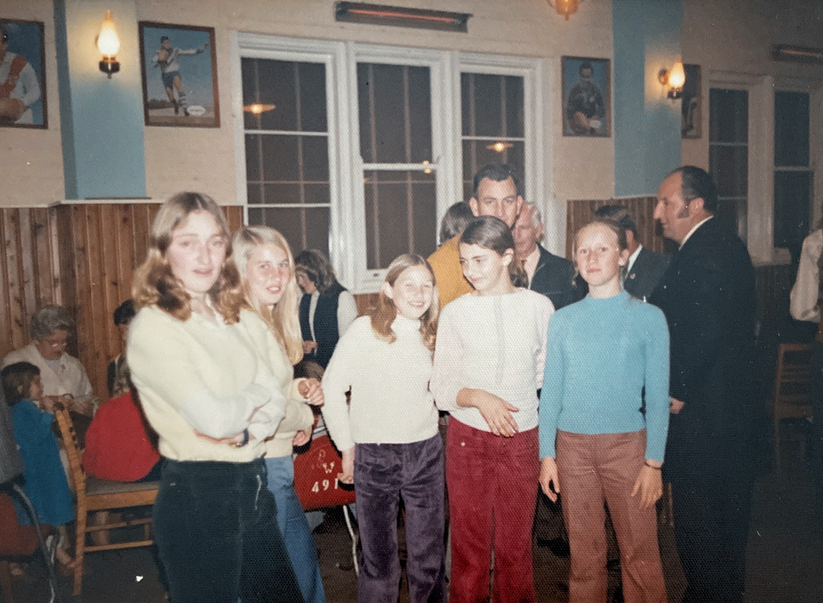 This photo was taken at Allen Baxter’s 21st in July 1973. In the foreground are Michelle Collins, Wendy Hill, Robyn Hill, Joanne Collins and Judy Geale. In the background are Albie Geale in a mustard shirt and Bob Collins in the dark suit.