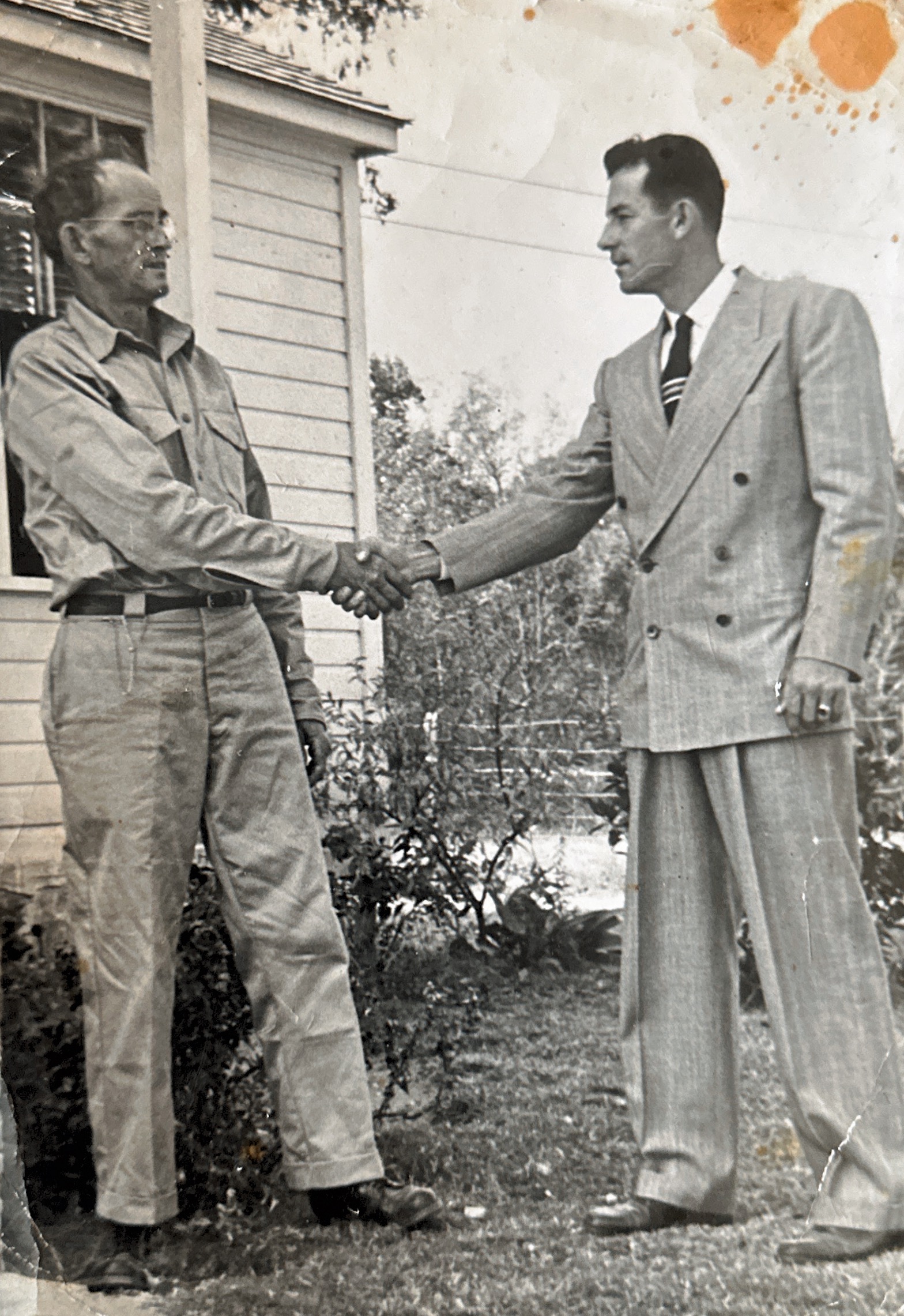 Elbert Friday shaking hands with county agent he was nominated for farmer of the year. Around mid-late 1940’s