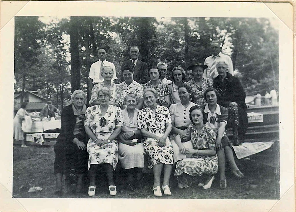 Abbott Reunion (at Dello Lake): Bottom Row L->R: Dill Wilcox, Mable Marshall, Mrs. Latrell, Aunt Anna Iveson, John Weaver's wife, Laura Weaver Doby's daughter Laura Weaver Doby; Middle Row L-R: Aunt Milly, Eva's cousin Dee Long, Eva Knight, Jean Iveson, Laura Iveson,Leva Southard; Last Row L-R: Lee, John Weaver, Ed Weaver , c. 1950s, poss. Ontario, Canada 