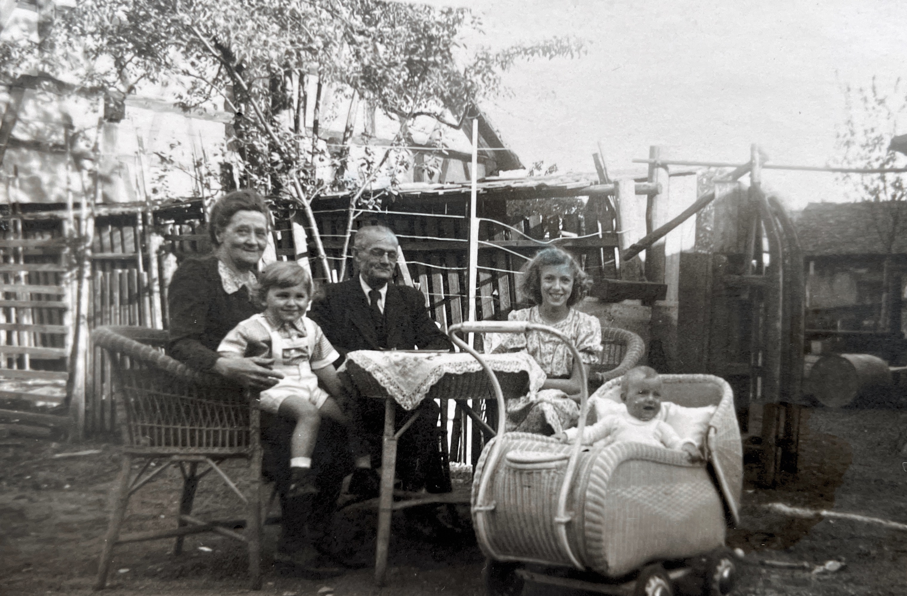 My grandparents, sister , cousin and myself in the pram. 1949