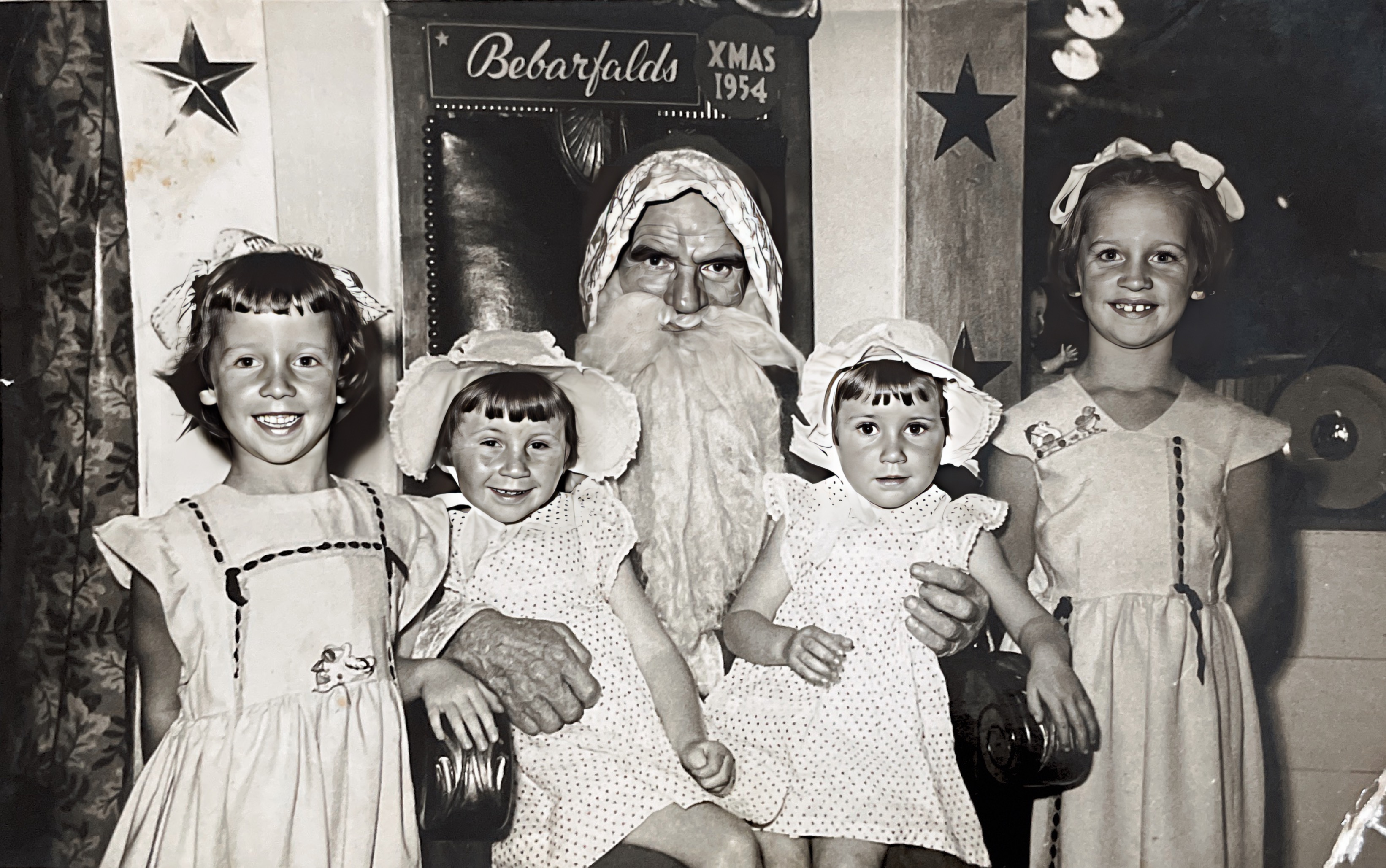 Claire and Maureen on Santa’s knee with friends Christmas 1954