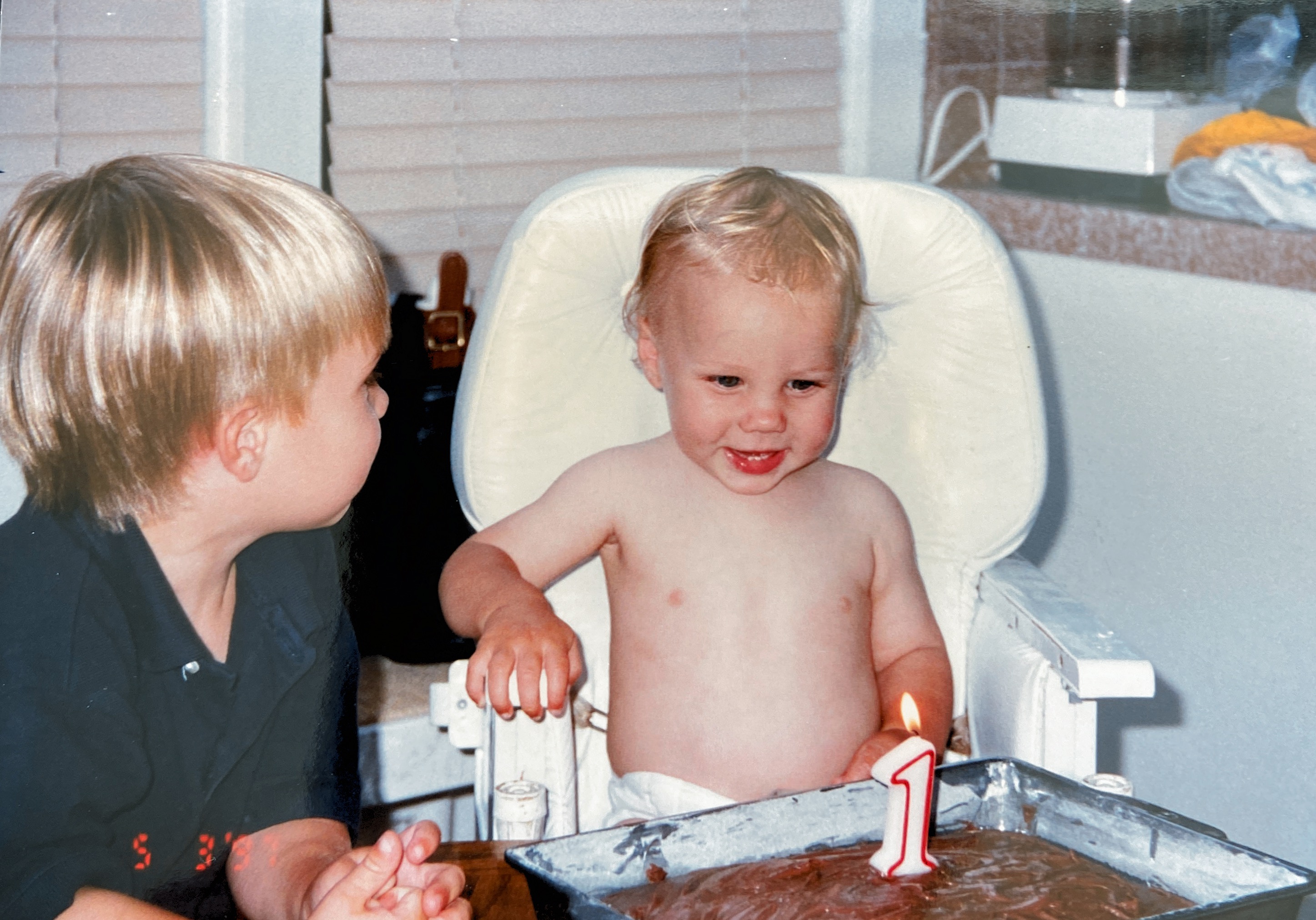 Corey’s 1st birthday, first chocolate cake with Ryan.