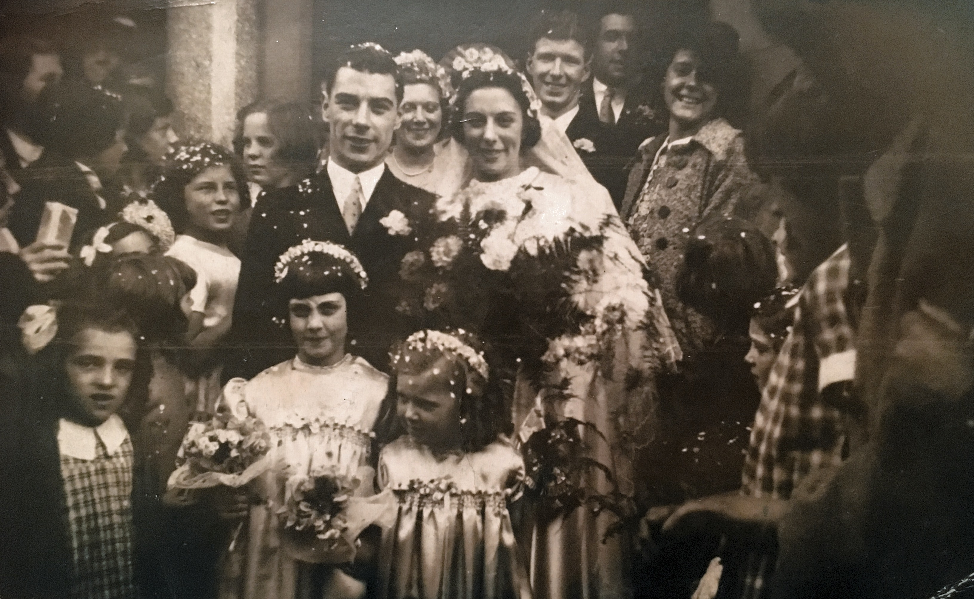 A wedding at some point in the 1930s. I don’t know who the couple are, but my grandmother is standing in the background to the right. 