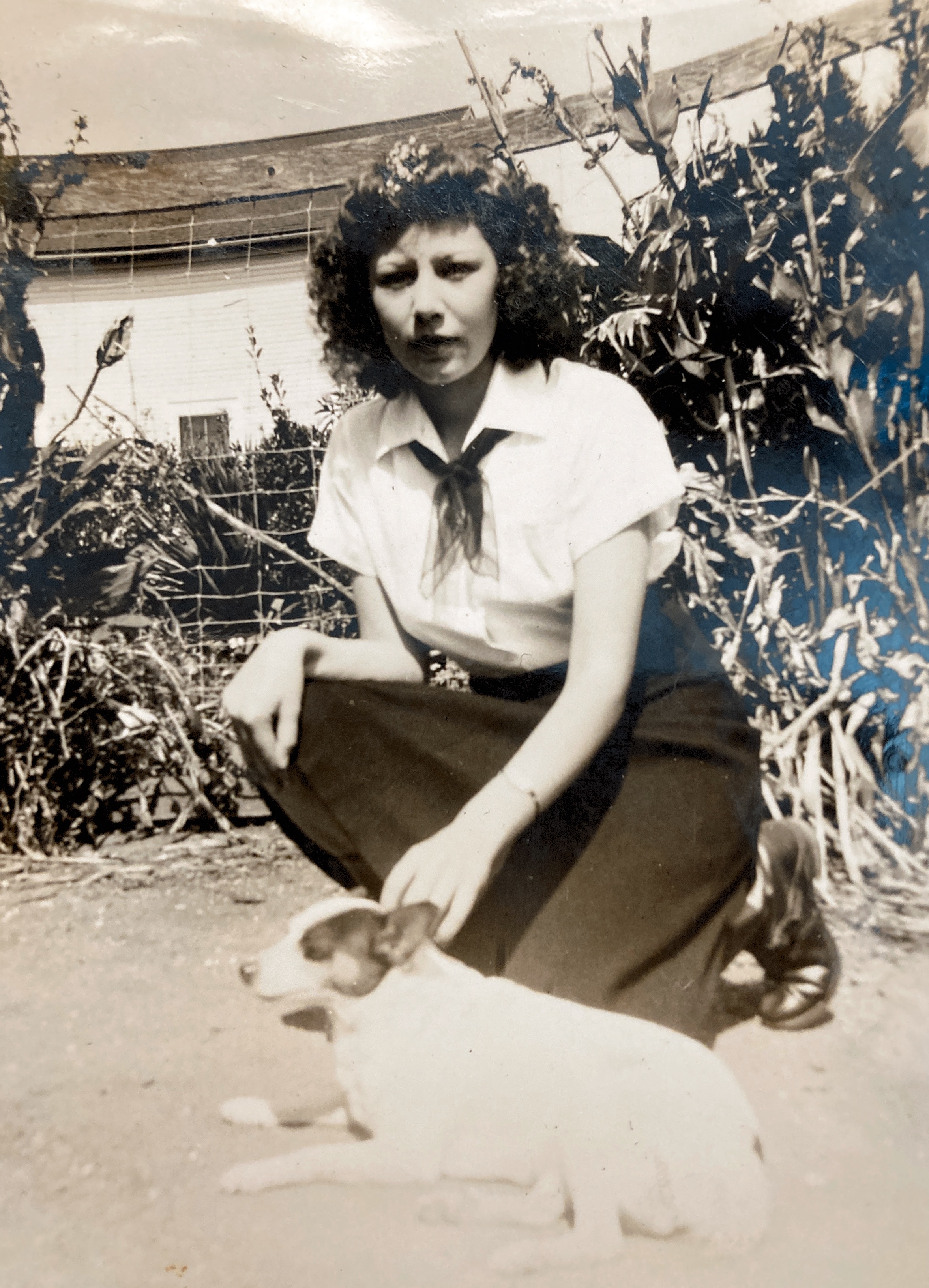 Mom and her dog Boots, about 1940.