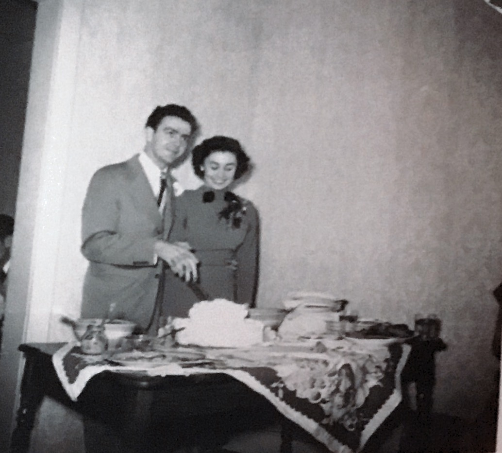 Neal and Kay cutting their wedding cake 3/25/1950